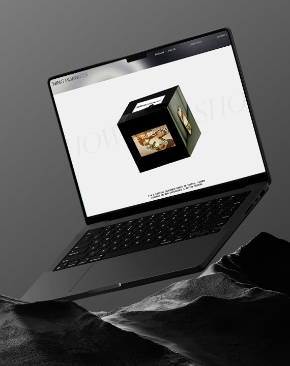 Laptop showcasing digital portfolio on rocky terrain